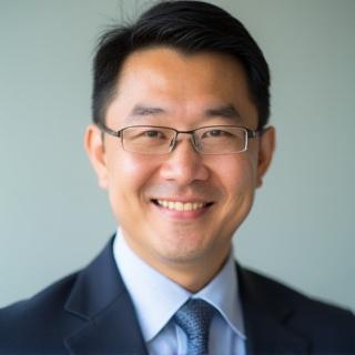 Professional headshot of David Chen.